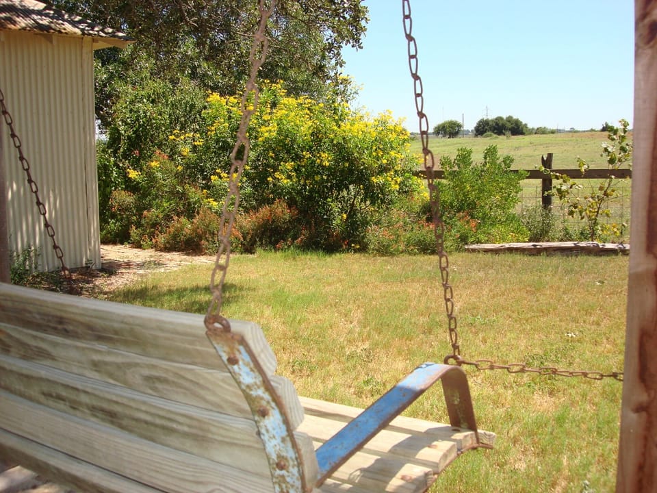 Come relax on the porch swing and watch cows grazing across the fence.
