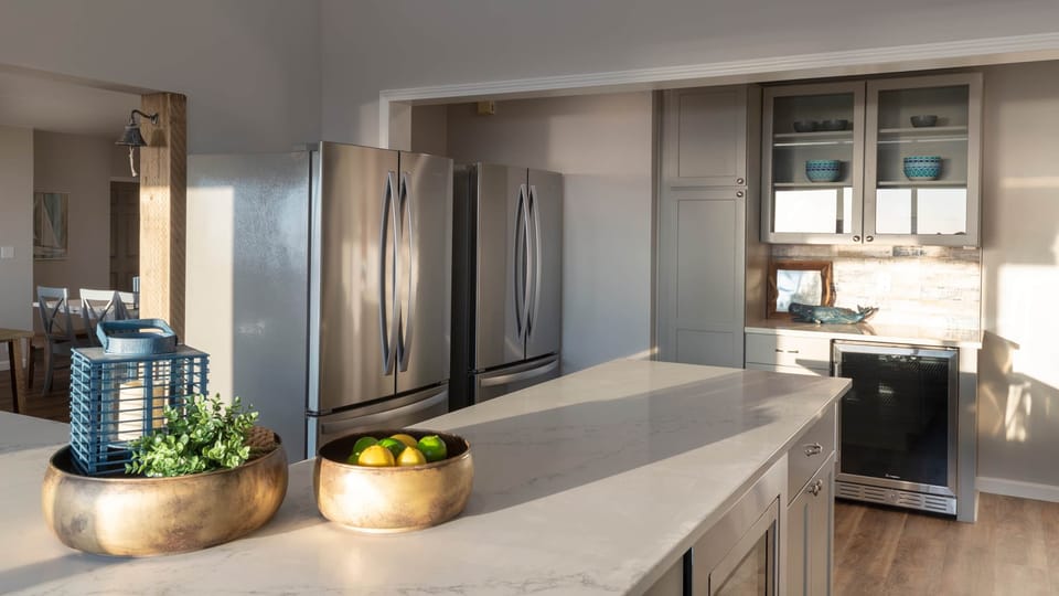 There are also two refrigerators and a wine fridge