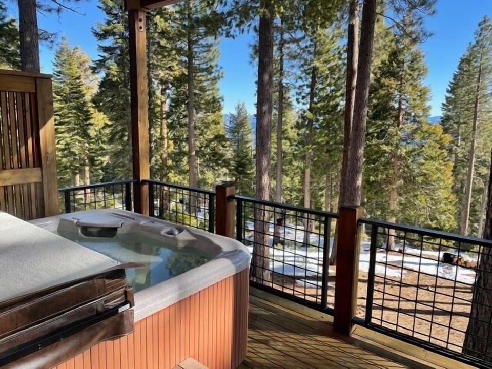 Take in the fresh air and incredible lake and forest views as you soak in the hot tub on the outdoor patio
