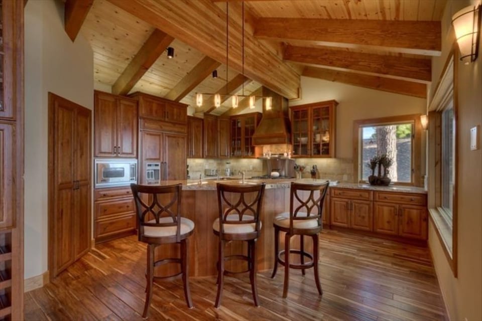 A stunning remodeled kitchen with a spacious island-bar, complete with everything you need to prepare meals with ease