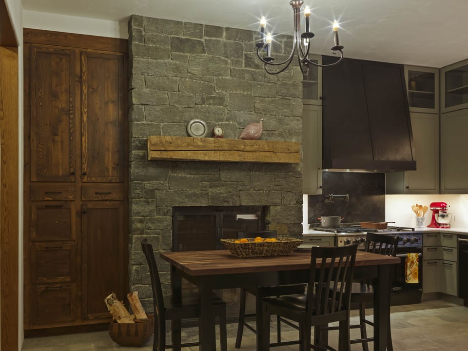 Cozy in-kitchen dining with fireplace