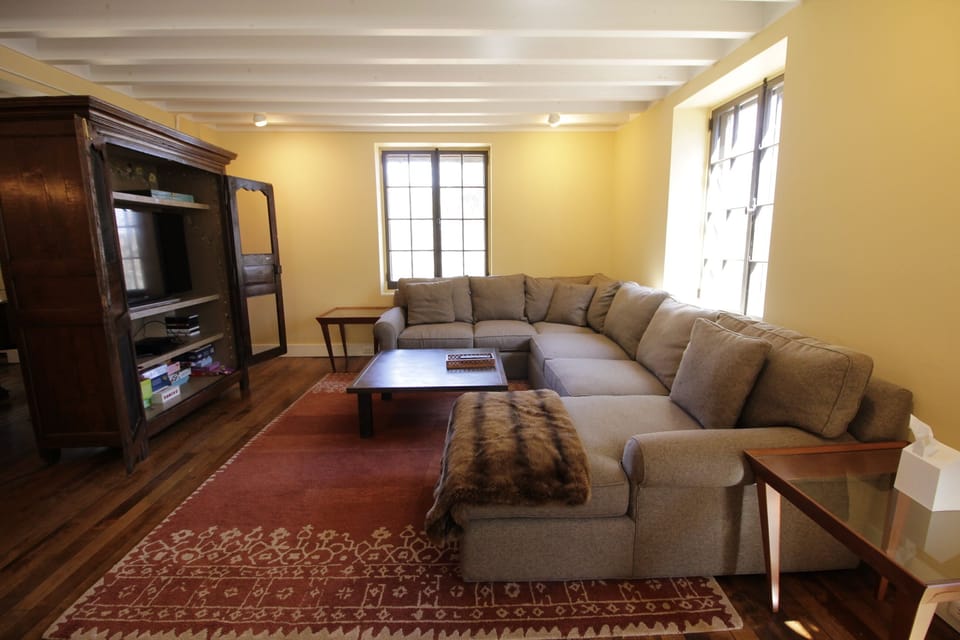 The t.v. corner has a cozy sofa, cable, internet and a selection of dvds.