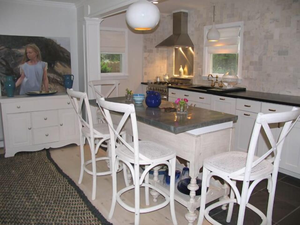 Zinc-topped kitchen island perfect for cocktails and snacks