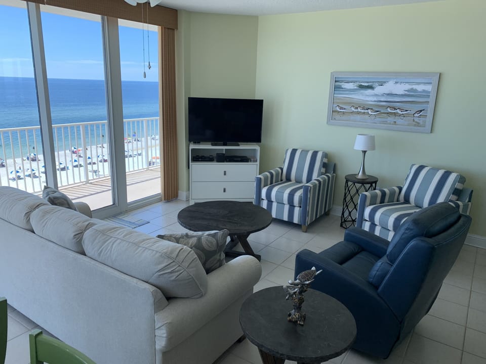 LR features HDTV and Blu-Ray, 2 chairs, a sofa, and swival rocker/recliner.