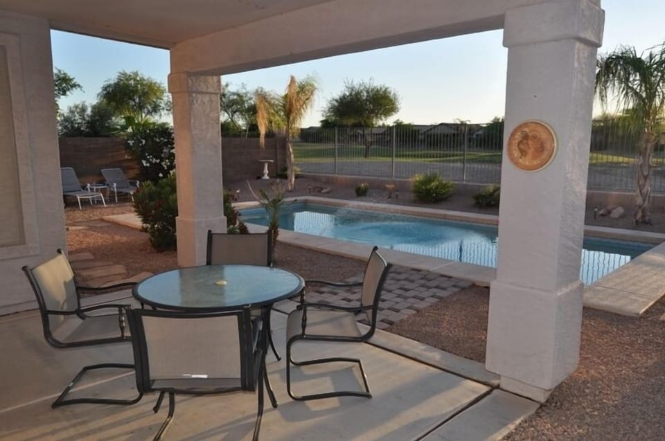 Nice covered patio for relaxing and watching the golfers on the 8th hole
