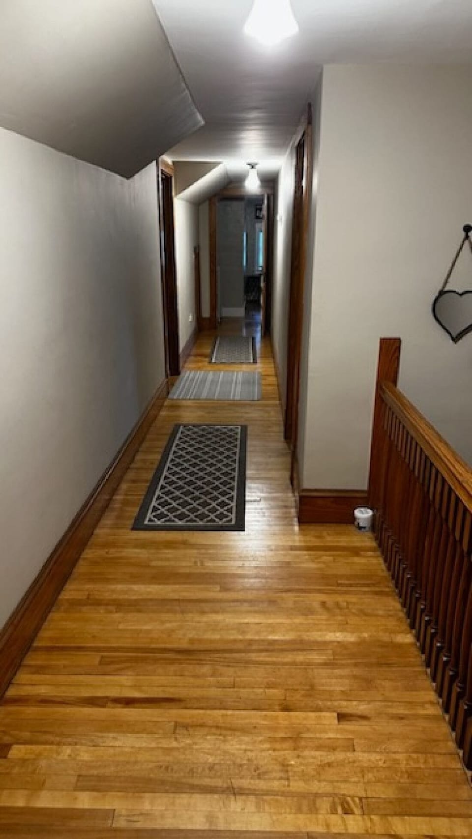 Upstairs Hallway with access to 2 bedrooms and 1 bathroom