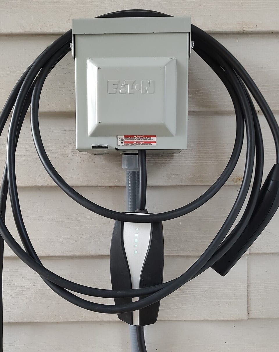 Garage equipped with 240V 50 Amp (NEMA 14-50) outlet. Perfect for Level 2 EV.