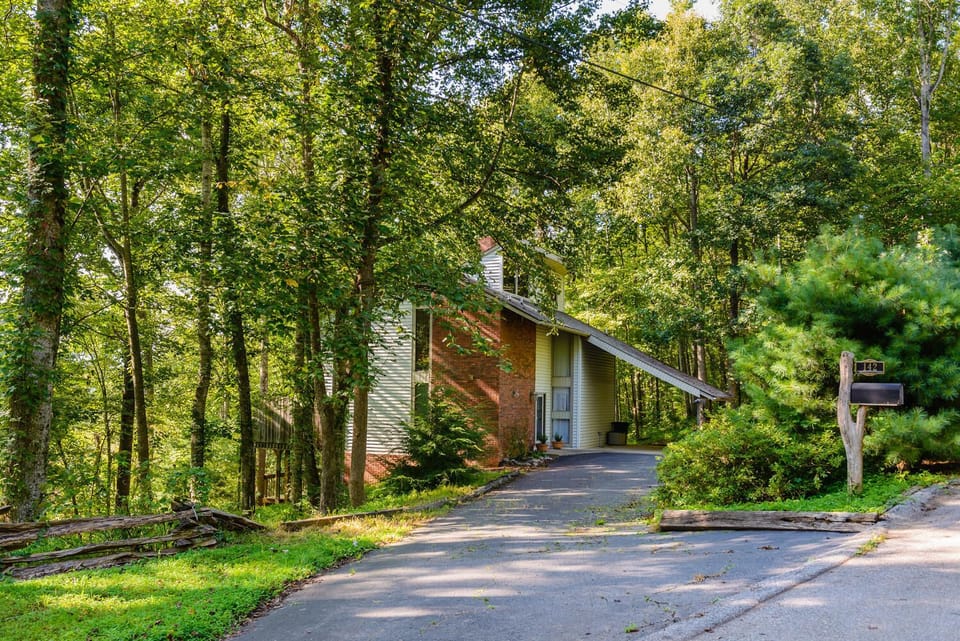 Private tri-level home in a wooded setting.
