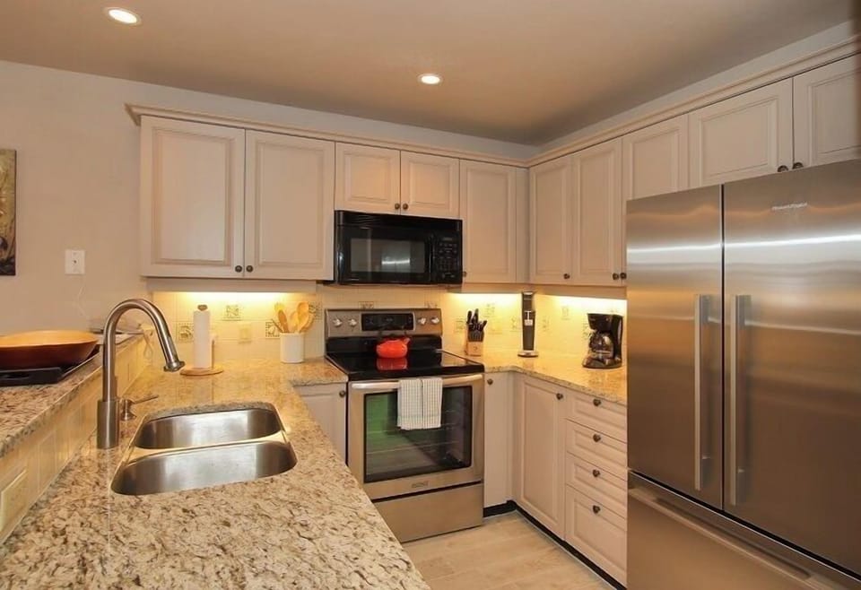 Kitchen with full assortment of cooking utensils