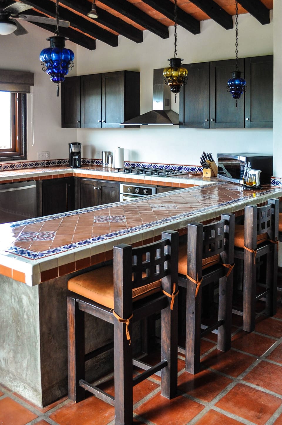 Large kitchen island and bar of the modern and fully equipped kitchen.