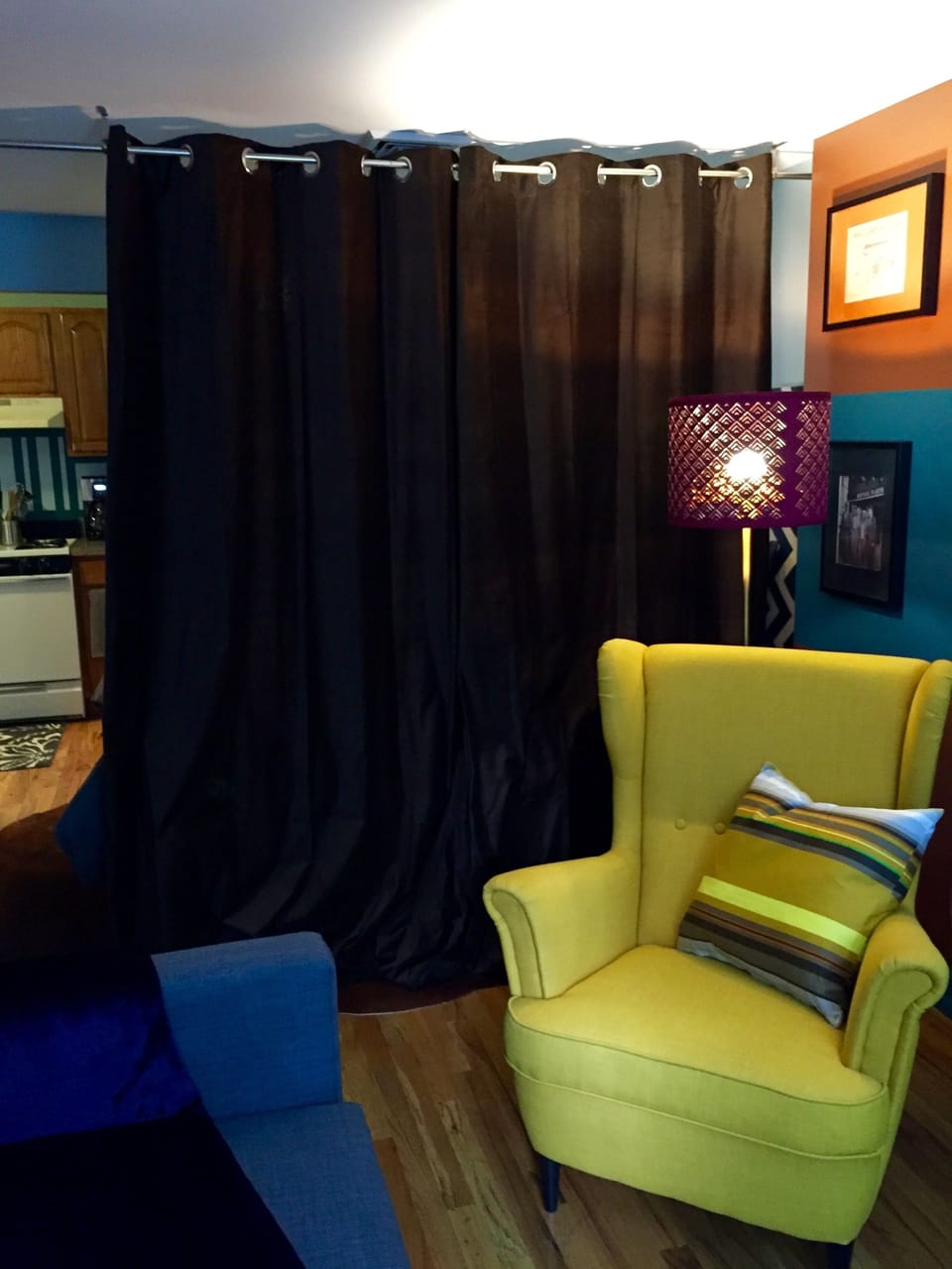 View of sleeping area from living room with privacy curtain closed