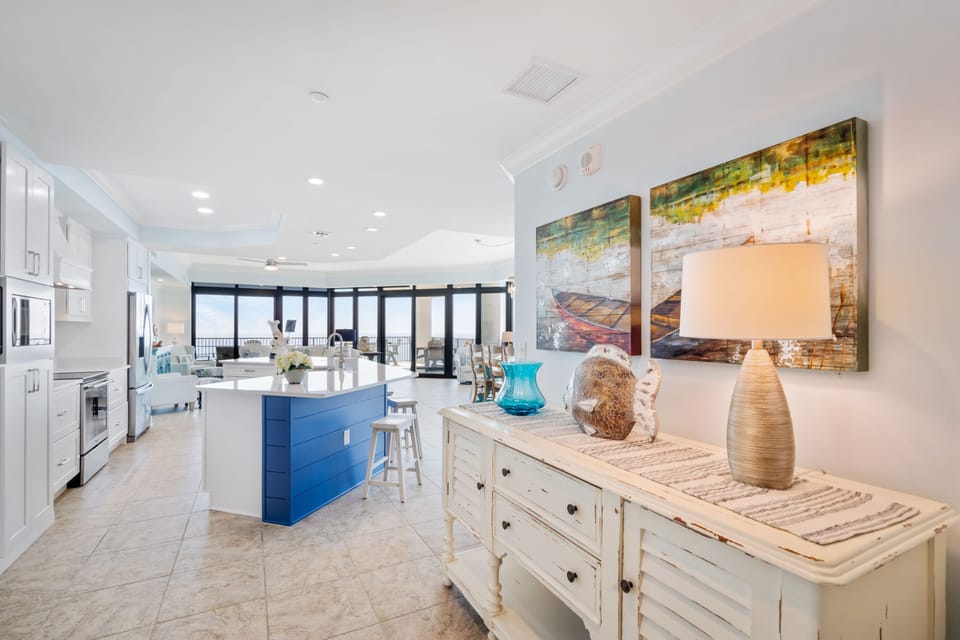 View from hall leading into kitchen & dining, pantry, family room & 3rd king bed