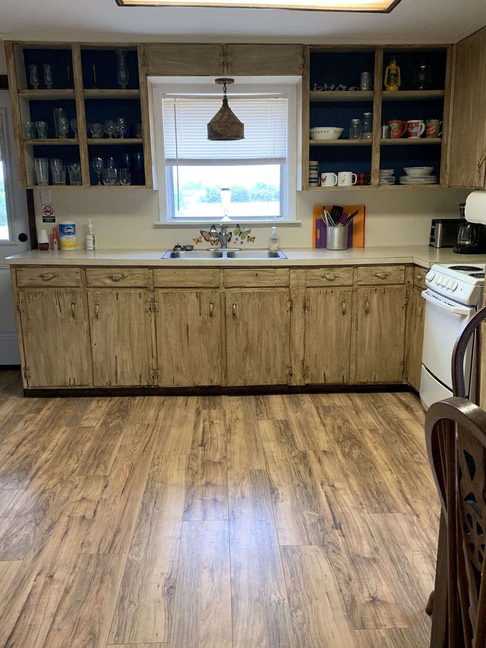 Kitchen with oven/stove, microwave, refrigerator/freezer