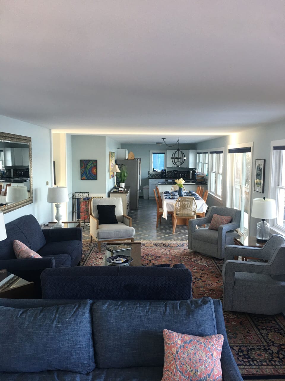 overview of living/dining/kitchen areas facing the blue bay