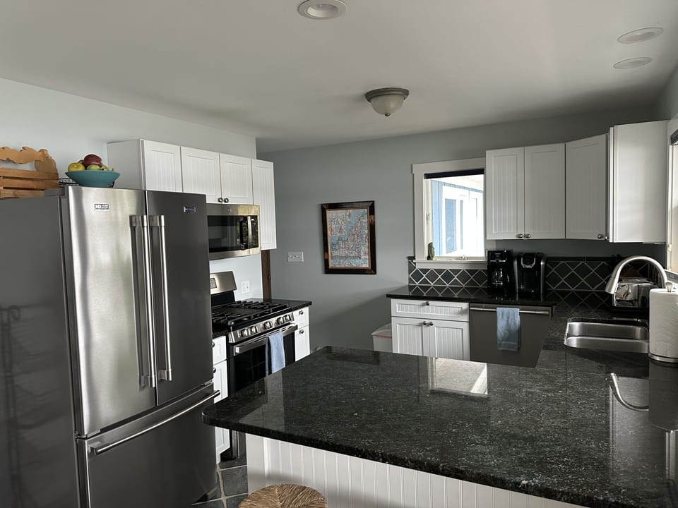 Kitchen detail from the dining area with stainless and granite