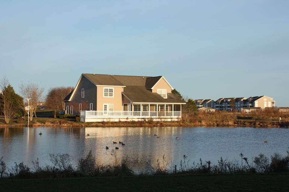 Back of home overlooking serene pond