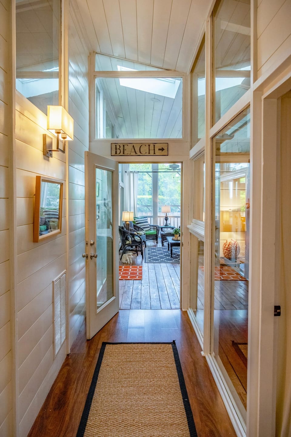 Enclosed breezeway leads to four bedrooms which can sleep 10 people and three bathrooms.