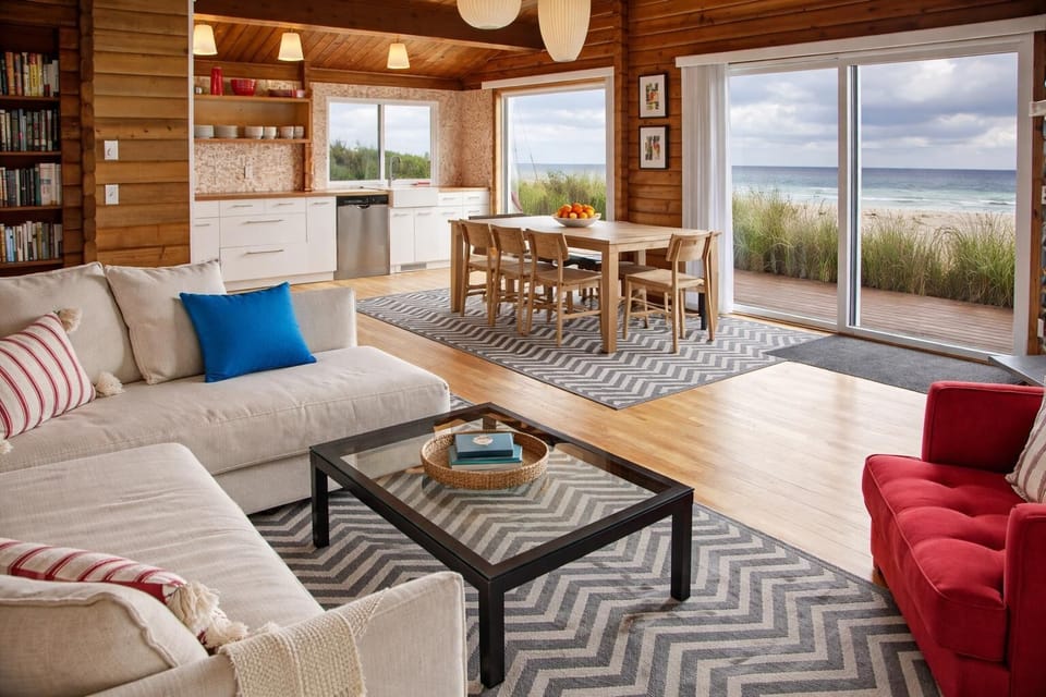 Light-filled living and dining in this modern Manzanita cabin—gather, relax, and enjoy Pacific views just beyond the deck
