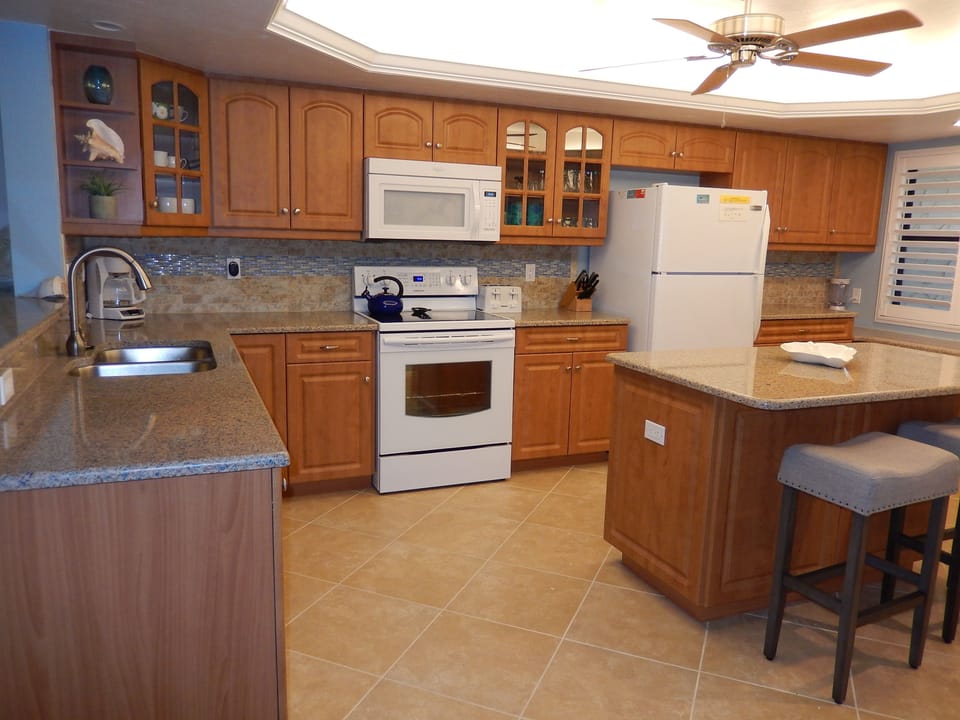 Kitchen with extensive amount of cookware and barbeque equipment