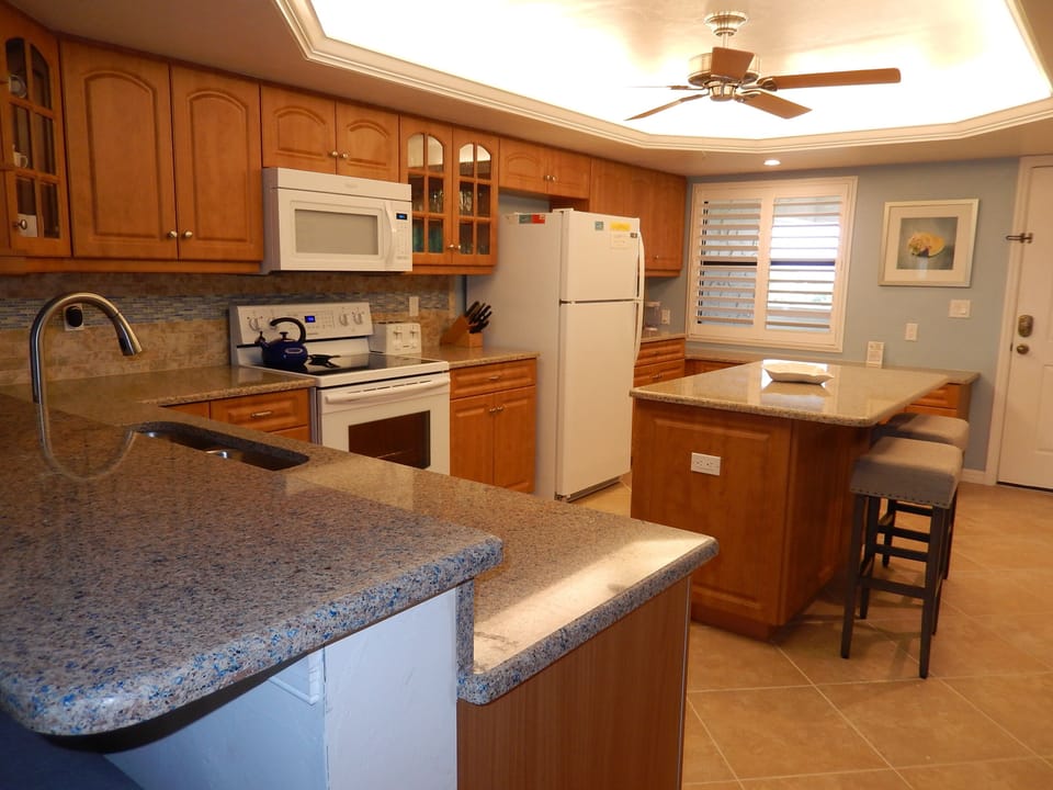 Kitchen with extensive amount of cookware and barbeque equipment