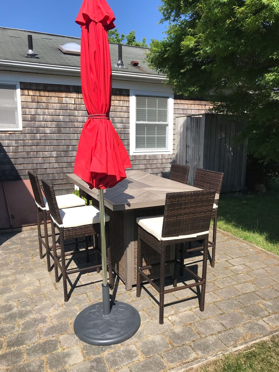Patio with Bar height fire dining table and outdoor shower 