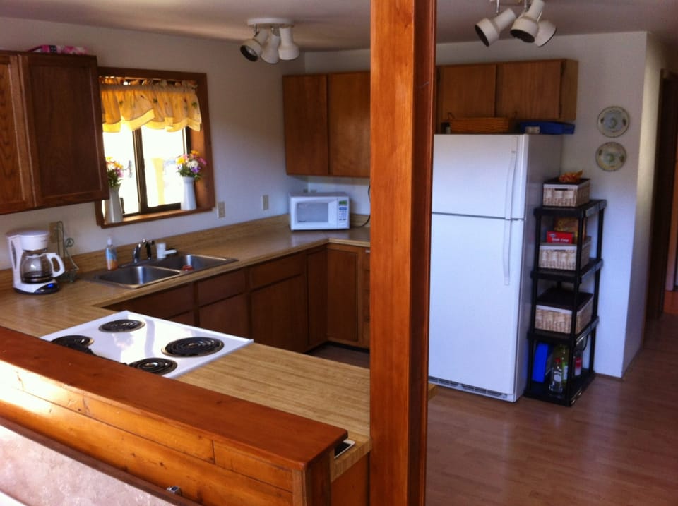 The kitchen is fully stocked with all your cooking needs.