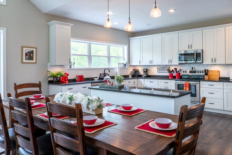 Great room dining room with full service kitchen and view of the lake.
