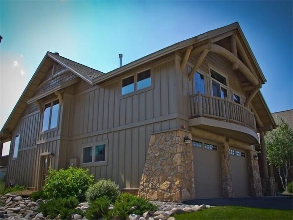 View of grand house; large balcony, view of creek, mtns and meadow on other side