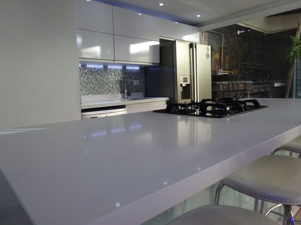 lux kitchen open to all area including outdoor 
BBQ