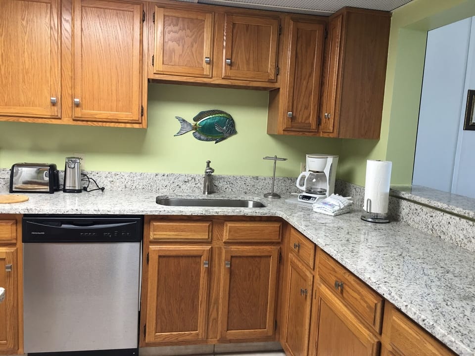 Fully-equipped kitchen with granite counters. 