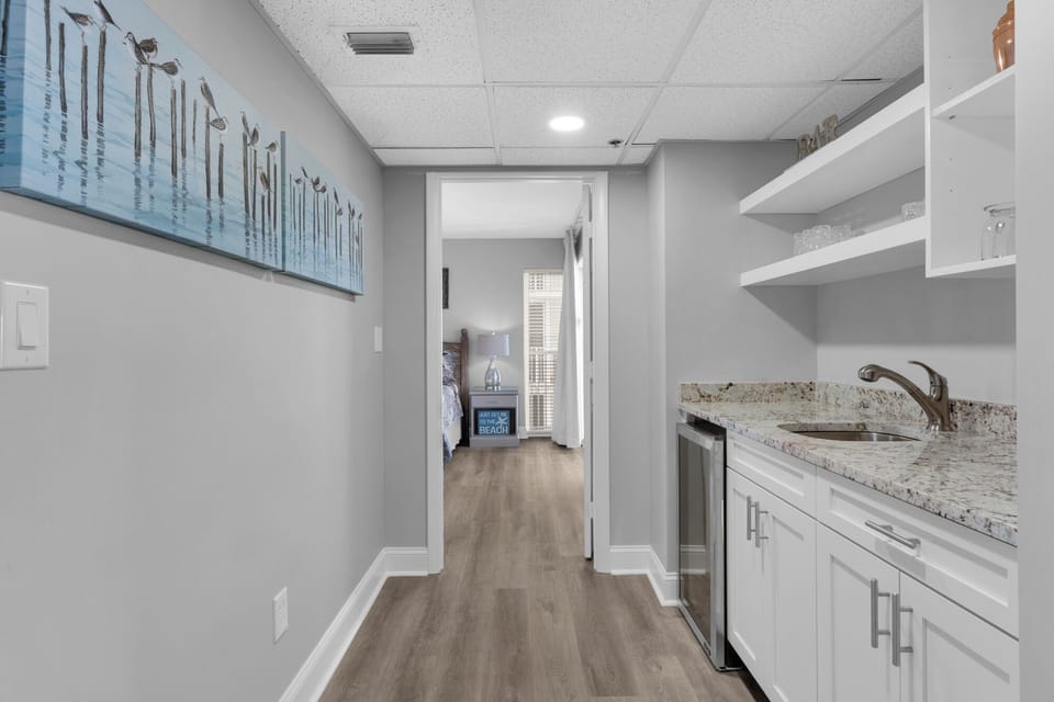 Coffee bar area and access to 2nd master suite with private balcony.