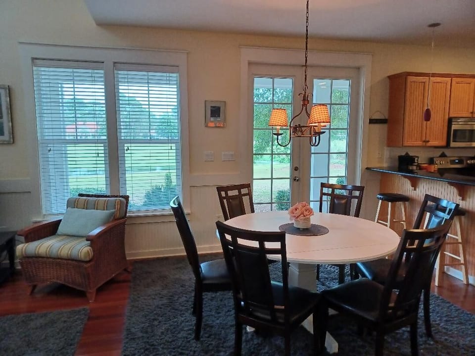 Views from Dining Room with French Doors to Deck and Grill