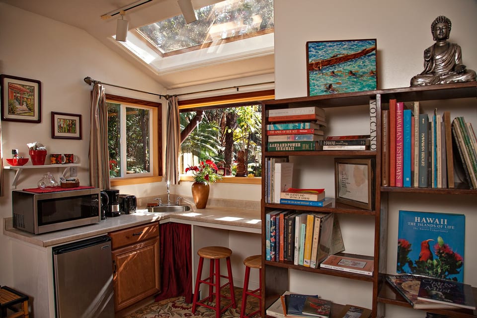 Kitchenette with one of 3 bookshelves, A book lovers haven. Many Hawaiiana books