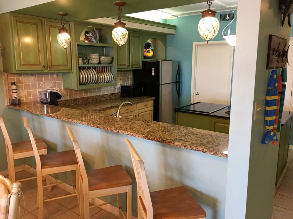 Bar seating, walk in pantry/laundry room and large center island.  