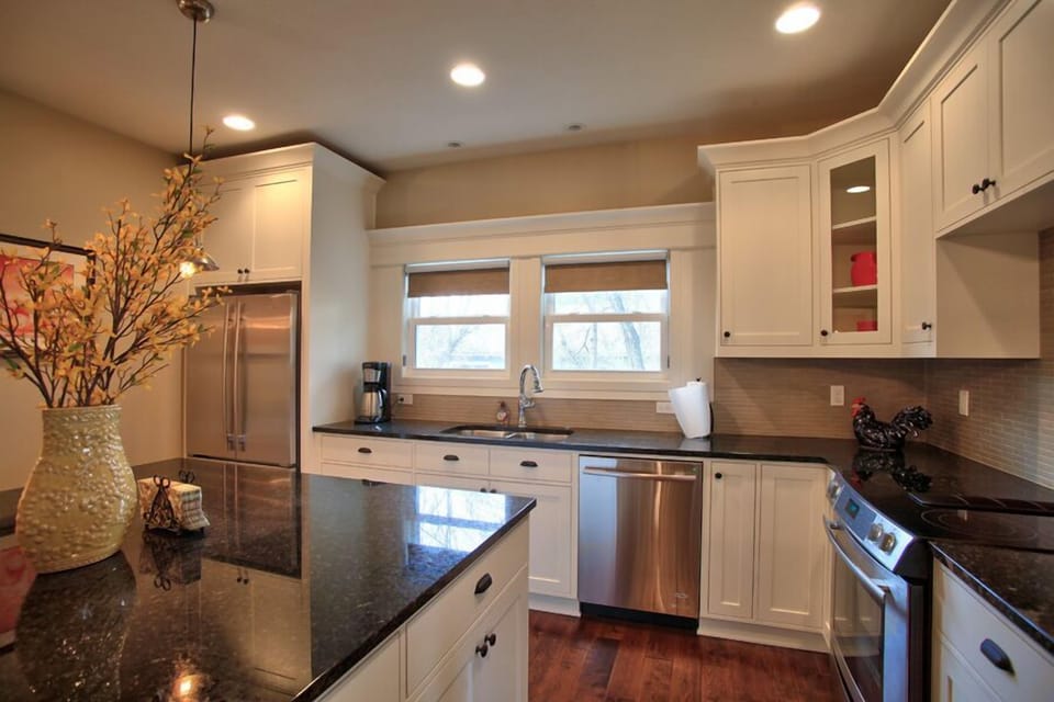 Gourmet Cooks Kitchen with slab granite counters & top end appliances