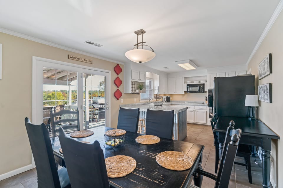 Large fully stocked kitchen with view of lake
