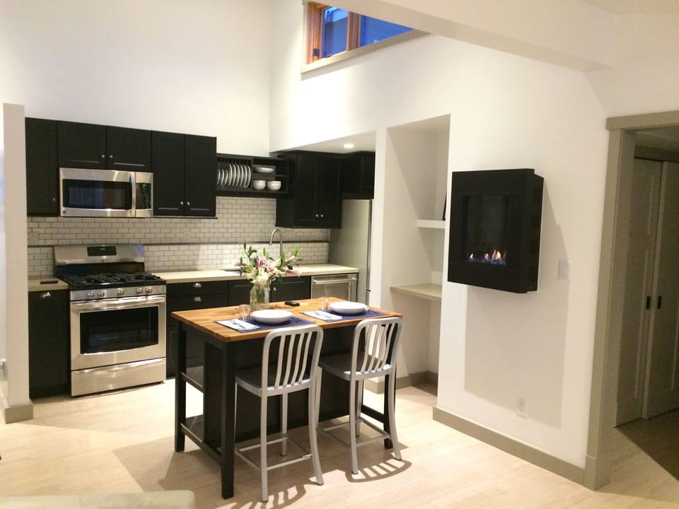 Kitchen, island and gas fireplace