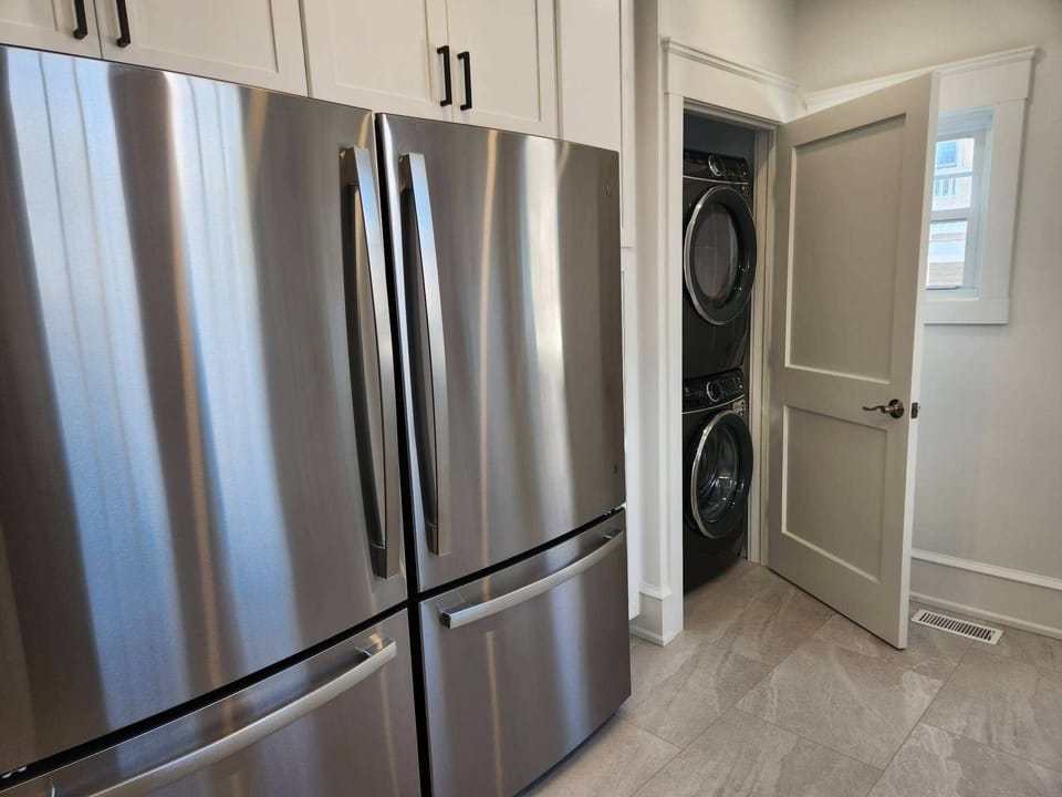 Two full-size refrigerators, and a full-size washer and dryer.