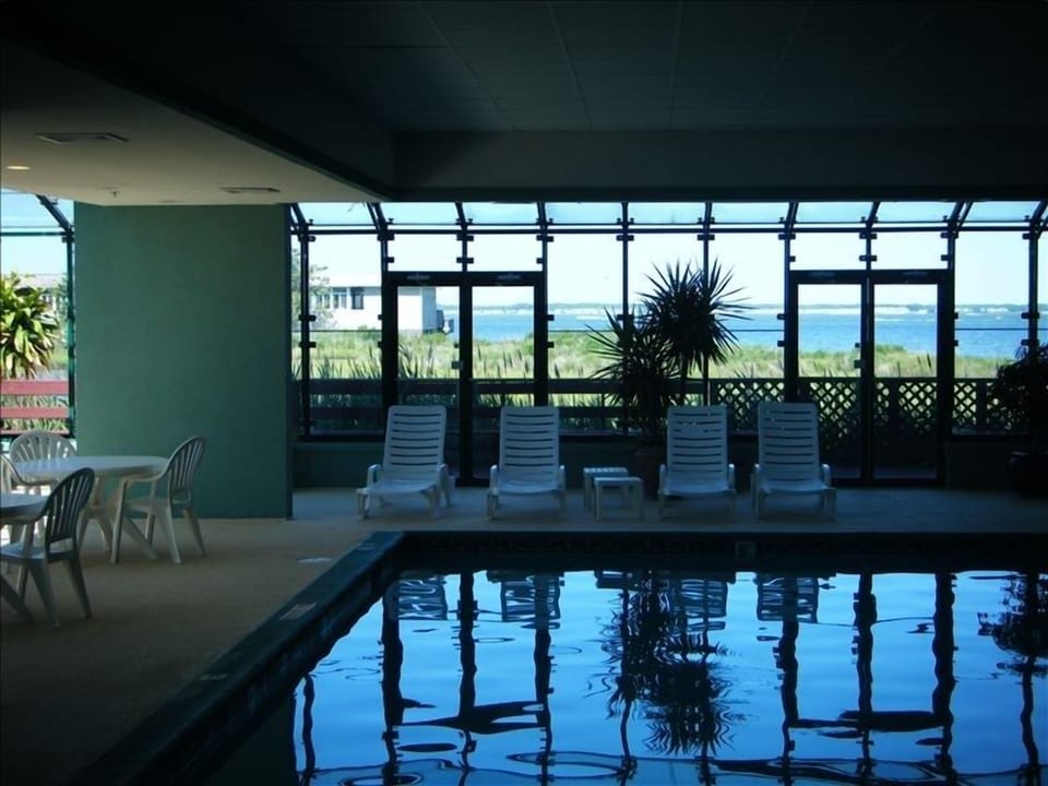 Enjoy the heated indoor pool year round while looking out across the bay.