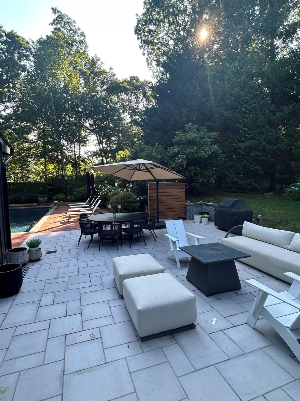 Outdoor patio space with couch and seating gas BBQ