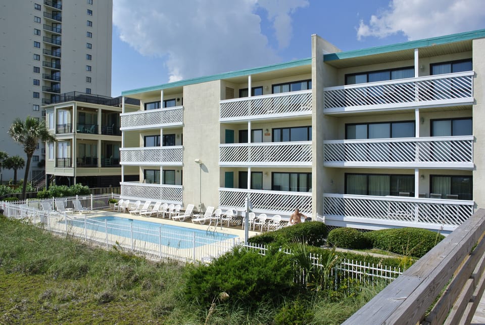 Spotless well-manicured complex just steps to FUN!