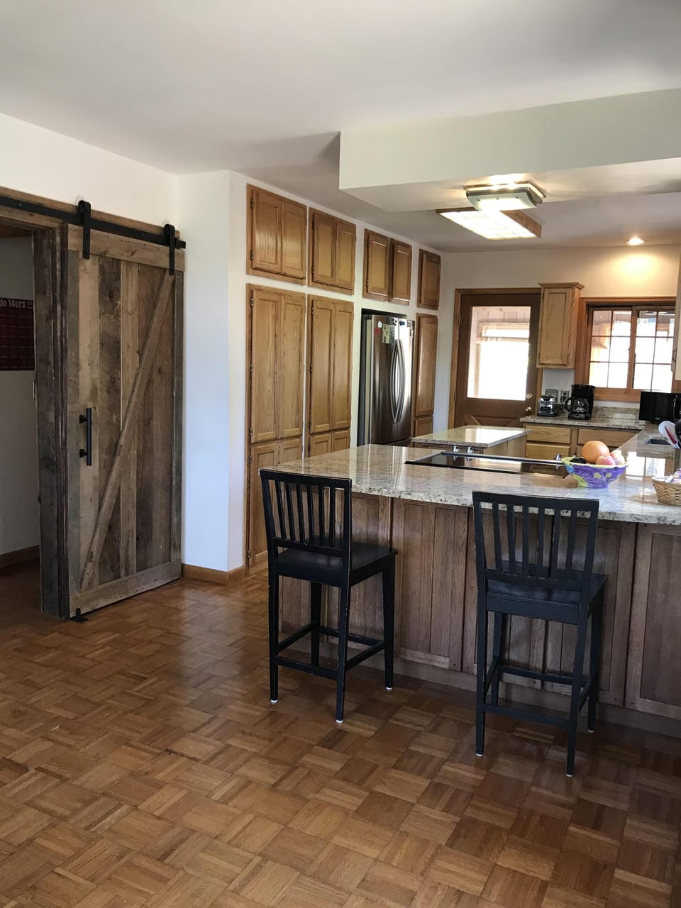 Kitchen and entry to main floor bedroom and bathroom