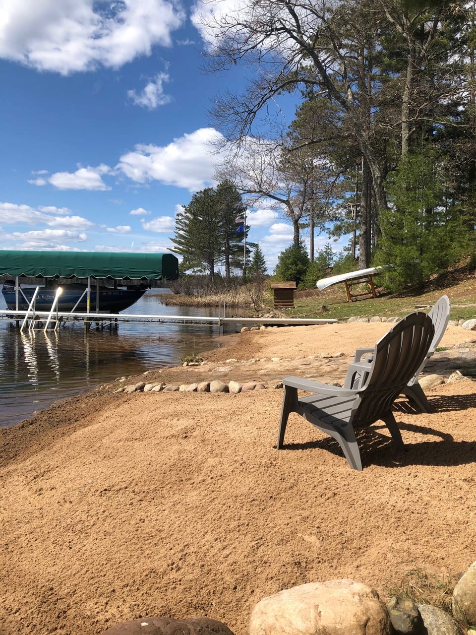 Enjoy the swim area and maintained sandy beach on this fisherman's lake