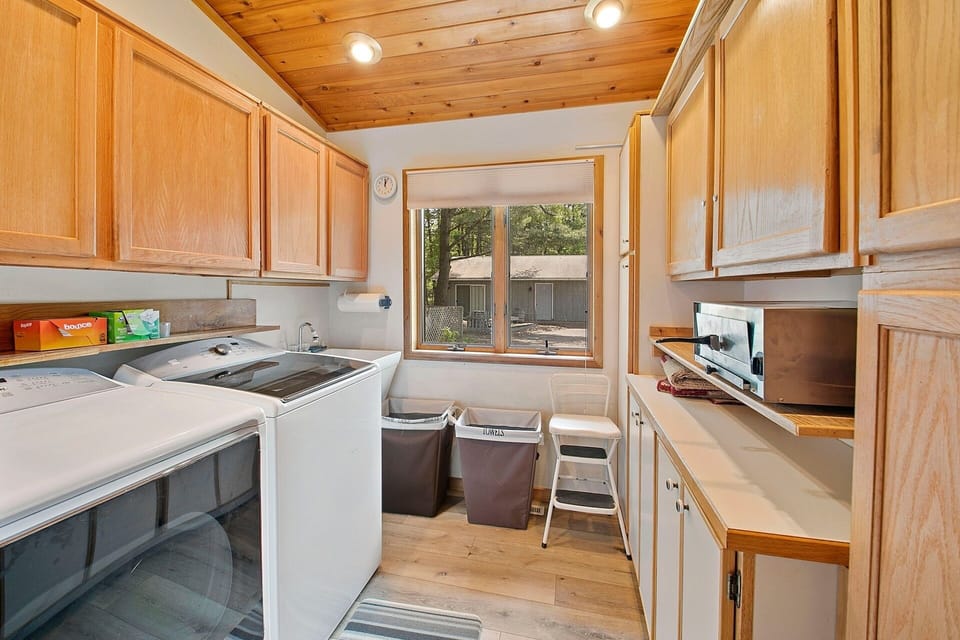 Main level laundry w a pizza oven for use to make a quick bite to eat