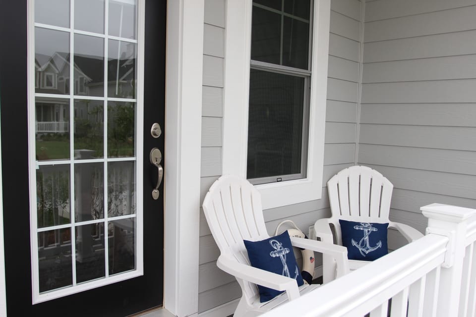 Front covered porch from bedroom/flex room with outdoor seating