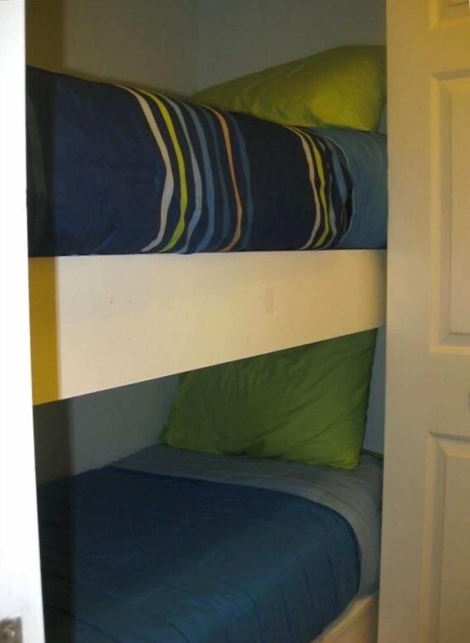 Crew bunks in hallway with doors for privacy