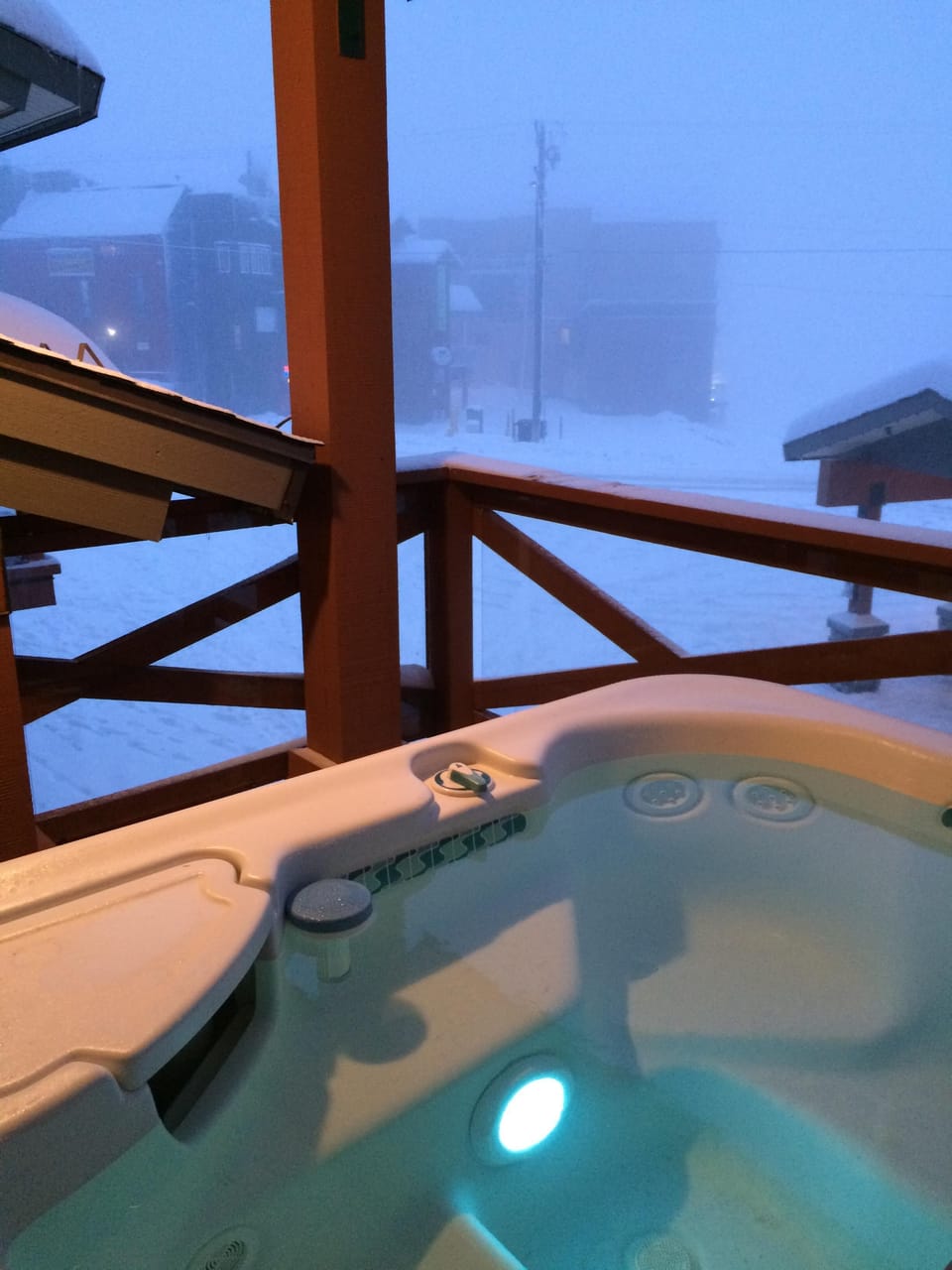 Hot tub with a view of the village and mountains (when its not snowing)