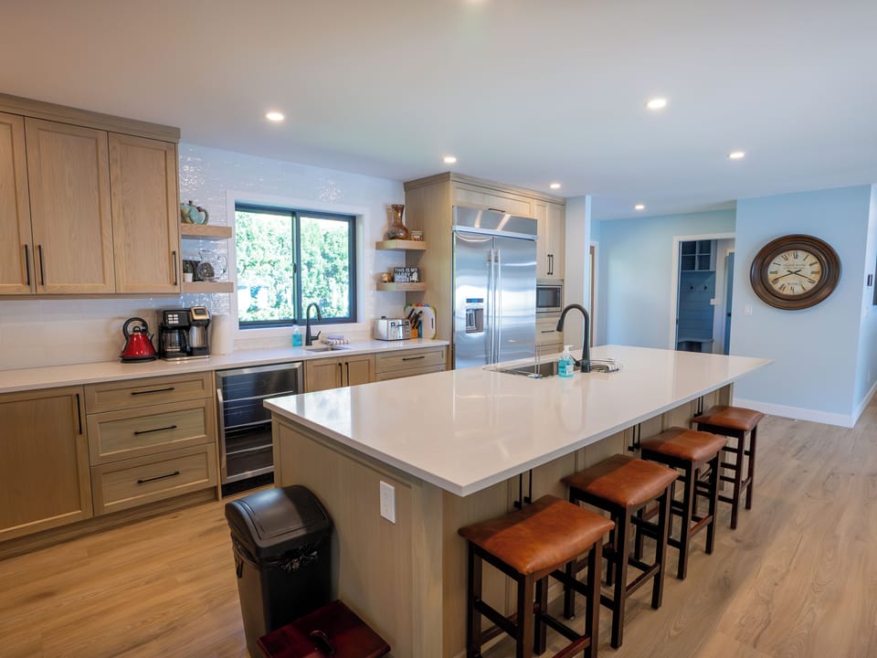 There is a kitchen sink and a bar sink. The 10 foot island has extra seating.