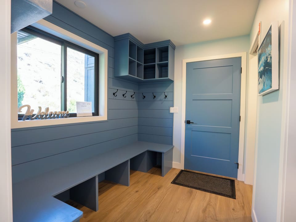 The mudroom offers plenty of space for jackets and gear.