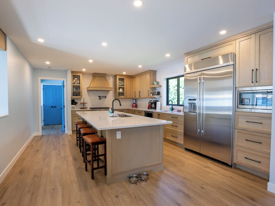 The kitchen is 20 X 10 feet with a large gas range, custom hood and pot filler.